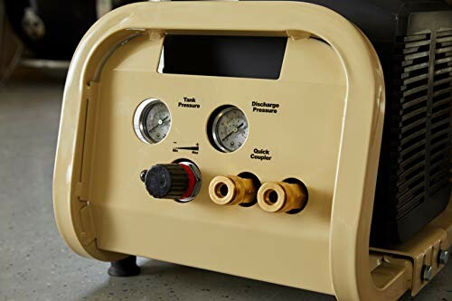 Close-up of an air compressor control panel with gauges and connectors.