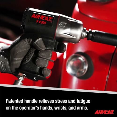 Person using AirCat impact wrench on red machinery