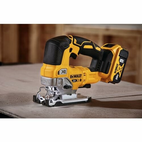 DeWalt cordless jigsaw on a wooden surface