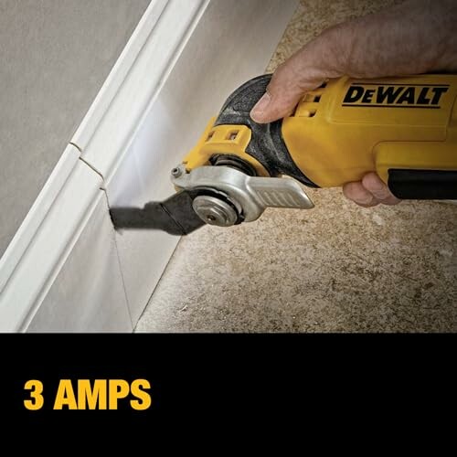 Person using DeWalt multitool for precise wall cutting.