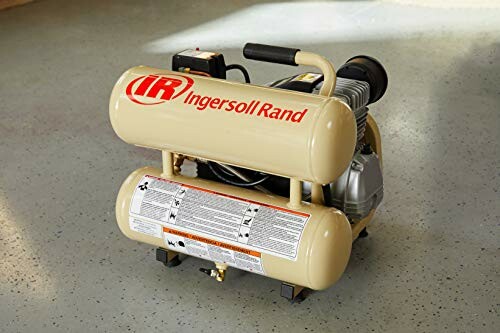 Ingersoll Rand air compressor on a concrete floor.