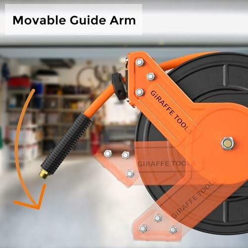 Hose reel with movable guide arm in a garage setting