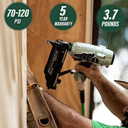 Person using a nail gun with specifications: 70-120 PSI, 5-year warranty, 3.7 pounds.