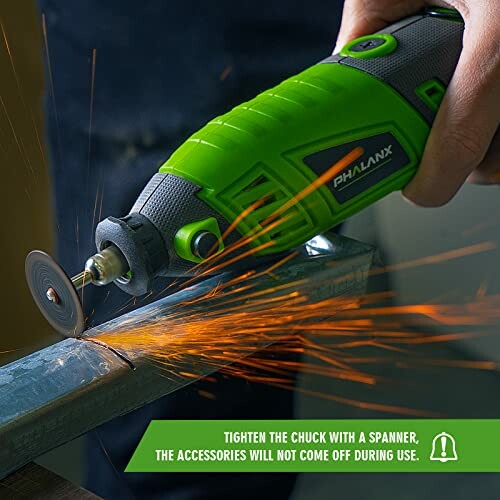 Hand using a green rotary tool cutting metal with sparks flying.