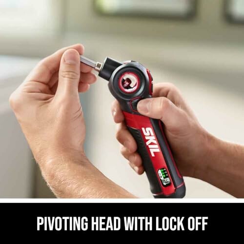 Hand holding a SKIL screwdriver with pivoting head