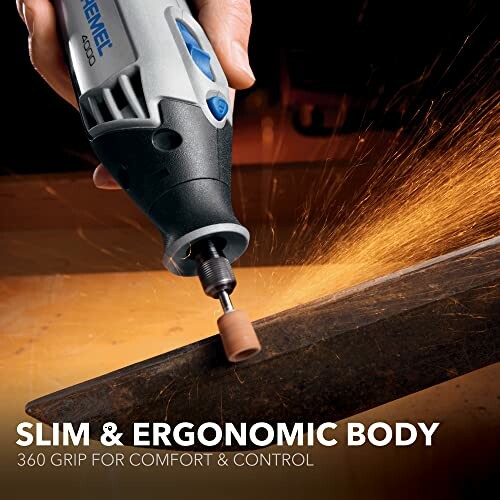 Rotary tool with slim, ergonomic body grinding metal with sparks.